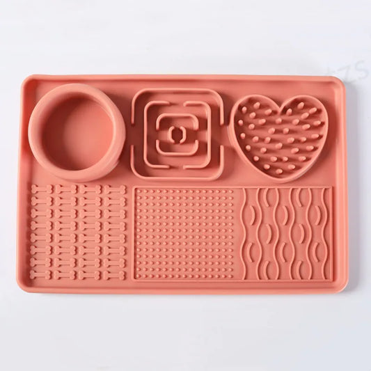 Terracotta silicone lick mat from above: round bowl well, square and heart-shaped areas, three textured zones