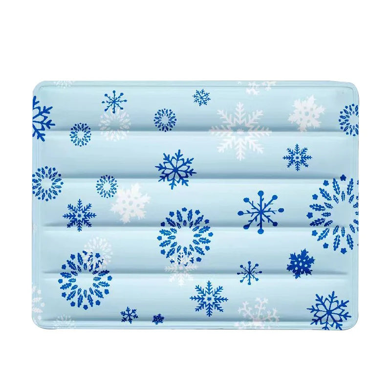 Light blue mat with blue and white snowflake print, seen from above on a white background