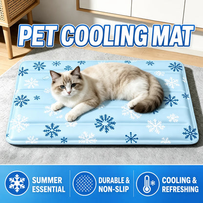 Long-haired cat lying on the light blue snowflake-print cooling mat on a grey rug, headline PET COOLING MAT