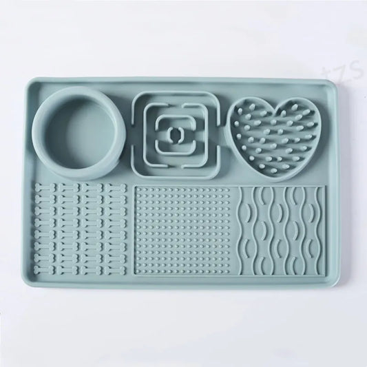 Sage green silicone lick mat from above: round bowl well, square and heart-shaped areas, three textured zones